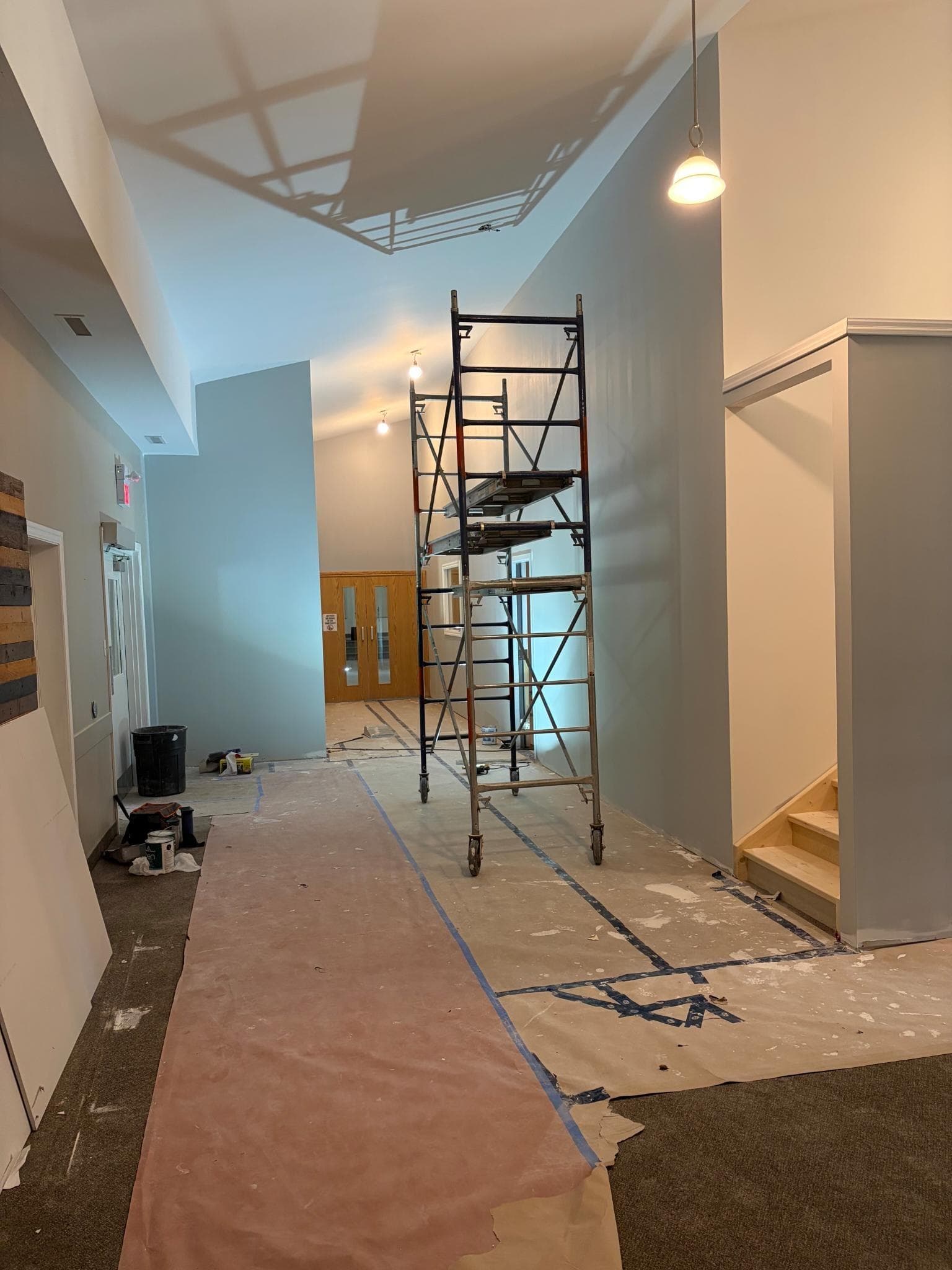 The main hallway under construction, with scaffolding and floor coverings